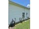 Side view of home displaying utility connections at 3337 Candlebrook St, The Villages, FL 32162