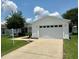 Charming home exterior featuring a well-maintained lawn and two car garage at 3337 Candlebrook St, The Villages, FL 32162