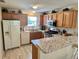 Bright kitchen featuring stainless steel appliances and granite countertops at 3337 Candlebrook St, The Villages, FL 32162