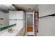 This bathroom features a white countertop with storage, a sink, and a mirror at 33913 Sabal Way, Leesburg, FL 34748