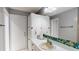 This bathroom features a white countertop with storage, a sink, and a mirror at 33913 Sabal Way, Leesburg, FL 34748