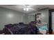Bedroom featuring a ceiling fan, a closet with mirror sliding doors, and a single bed at 33913 Sabal Way, Leesburg, FL 34748