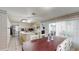 Bright kitchen featuring an island, stainless steel appliances, and access to the outdoor patio at 33913 Sabal Way, Leesburg, FL 34748