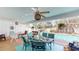 This covered patio features a private pool surrounded by lounge seating and a dining area at 33913 Sabal Way, Leesburg, FL 34748