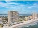 Aerial view of the condo building with direct beach access and nearby amenities at 3425 S Atlantic Ave # 1101, Daytona Beach, FL 32118