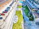 Aerial view of property with beach access and beautifully landscaped grounds at 3425 S Atlantic Ave # 1101, Daytona Beach, FL 32118