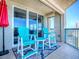 Private balcony with cozy seating area perfect for relaxation and ocean views at 3425 S Atlantic Ave # 1101, Daytona Beach, FL 32118