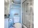 Light-filled bathroom with modern fixtures, glass shower enclosure and decorative wall art at 3425 S Atlantic Ave # 1101, Daytona Beach, FL 32118