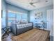 The bedroom features a large window for natural light, and neutral-colored walls and furniture at 3425 S Atlantic Ave # 1101, Daytona Beach, FL 32118