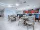 Inviting dining area featuring a kitchen bar, bar seating, dining tables, and tile flooring at 3425 S Atlantic Ave # 1101, Daytona Beach, FL 32118