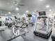 Spacious fitness center with an array of equipment, mirrors, ceiling fans, and rubber flooring at 3425 S Atlantic Ave # 1101, Daytona Beach, FL 32118