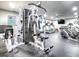 Bright fitness center offering various exercise machines, treadmills, weights, and a wall-mounted television at 3425 S Atlantic Ave # 1101, Daytona Beach, FL 32118