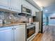 Modern kitchen features stainless steel appliances, granite countertops, and ample storage at 3425 S Atlantic Ave # 1101, Daytona Beach, FL 32118