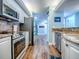 Efficient kitchen equipped with stainless steel appliances and sleek cabinetry with ample counter space at 3425 S Atlantic Ave # 1101, Daytona Beach, FL 32118