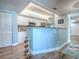 Open kitchen with breakfast bar, white cabinets and ample storage space at 3425 S Atlantic Ave # 1101, Daytona Beach, FL 32118