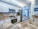Well-equipped kitchen with granite countertops and modern stainless steel appliances at 3425 S Atlantic Ave # 1101, Daytona Beach, FL 32118