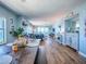 Spacious dining and living area with ocean views, light blue walls, and wood flooring at 3425 S Atlantic Ave # 1101, Daytona Beach, FL 32118