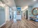 Bright living room with hardwood floors seamlessly connecting to kitchen and bedroom areas at 3425 S Atlantic Ave # 1101, Daytona Beach, FL 32118