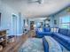 Open living room with modern decor, comfortable seating and large windows at 3425 S Atlantic Ave # 1101, Daytona Beach, FL 32118