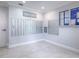Neutral mail room with white baseboards and white tile flooring and mailboxes at 3425 S Atlantic Ave # 1101, Daytona Beach, FL 32118