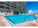 Stunning pool and jacuzzi area in front of a condo building with ocean views at 3425 S Atlantic Ave # 1101, Daytona Beach, FL 32118