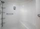This bright shower features tiled walls, a built-in seat, and convenient shelving at 3425 S Atlantic Ave # 1101, Daytona Beach, FL 32118