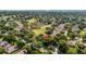 Aerial shot showcasing the home's location in a leafy neighborhood next to a golf course at 3607 Fairfield Dr, Clermont, FL 34711