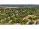 An aerial view of the neighborhood shows the beautiful landscaping, nearby lake, and well-maintained community at 3607 Fairfield Dr, Clermont, FL 34711