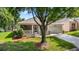 Charming single-story home with well-maintained landscaping, mature trees and a driveway at 3607 Fairfield Dr, Clermont, FL 34711
