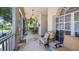 Inviting front porch featuring comfortable seating, a ceiling fan, and views of the manicured neighborhood at 3607 Fairfield Dr, Clermont, FL 34711
