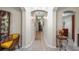 Elegant hallway with archways, modern flooring, and stylish decor leading to other rooms at 3607 Fairfield Dr, Clermont, FL 34711