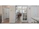 Hallway view looking into the office with french doors, and showing the wood flooring at 3607 Fairfield Dr, Clermont, FL 34711