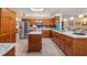Large kitchen with granite counters, stainless appliances, a kitchen island, and ample storage space at 3607 Fairfield Dr, Clermont, FL 34711