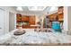 Spacious kitchen featuring an island with granite countertops, stainless steel appliances, and wood cabinetry at 3607 Fairfield Dr, Clermont, FL 34711