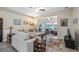 Inviting living room featuring neutral tones, modern ceiling fans, and bright, natural light at 3607 Fairfield Dr, Clermont, FL 34711