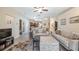 Bright living room with lots of seating, decor, ceiling fan, and an open floor plan at 3607 Fairfield Dr, Clermont, FL 34711