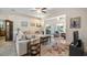 Inviting living room featuring neutral tones, modern ceiling fans, and bright, natural light at 3607 Fairfield Dr, Clermont, FL 34711