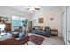 Living room features a ceiling fan, natural light, and an adjacent closet at 3607 Fairfield Dr, Clermont, FL 34711