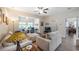 Bright living room boasts modern ceiling fans, neutral furniture, and an open, airy feel at 3607 Fairfield Dr, Clermont, FL 34711