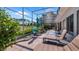 A perfect screened-in patio with outdoor seating, golf course view, and tiled flooring at 3607 Fairfield Dr, Clermont, FL 34711