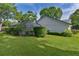 Manicured lawn and privacy hedges enhance the appeal of this well-maintained backyard space at 36535 Eagle Dr, Grand Island, FL 32735