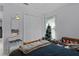 Bedroom with a large closet, a small Christmas tree, and a bed at 36535 Eagle Dr, Grand Island, FL 32735