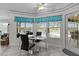 Bright breakfast nook with tile flooring, a table with chairs, and views of the pool at 36535 Eagle Dr, Grand Island, FL 32735