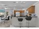 Bright kitchen boasts tile flooring, a breakfast bar with seating, and wood cabinets at 36535 Eagle Dr, Grand Island, FL 32735