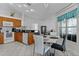 Bright kitchen features tile flooring, white appliances, and a view to the breakfast nook at 36535 Eagle Dr, Grand Island, FL 32735