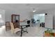 Open concept living room with tile flooring, multiple seating areas, and natural light at 36535 Eagle Dr, Grand Island, FL 32735