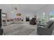 Open living room featuring tile floors, comfortable seating, and ample natural light at 36535 Eagle Dr, Grand Island, FL 32735