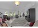 Bright living room showcasing tile floors, a plush rug, and multiple seating options at 36535 Eagle Dr, Grand Island, FL 32735