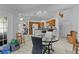 Open-concept living area flows seamlessly into kitchen with ample seating and natural light at 36535 Eagle Dr, Grand Island, FL 32735