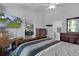 Well-lit main bedroom with en-suite bathroom and comfortable furnishings at 36535 Eagle Dr, Grand Island, FL 32735